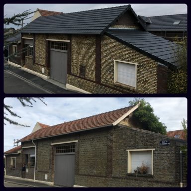 Maison en pierre avec un toit en ardoise, montrant une façade rénovée et un environnement calme.